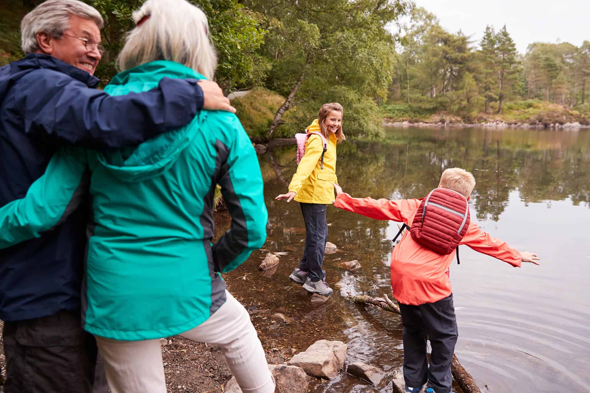 grandparents and grandkids at pond