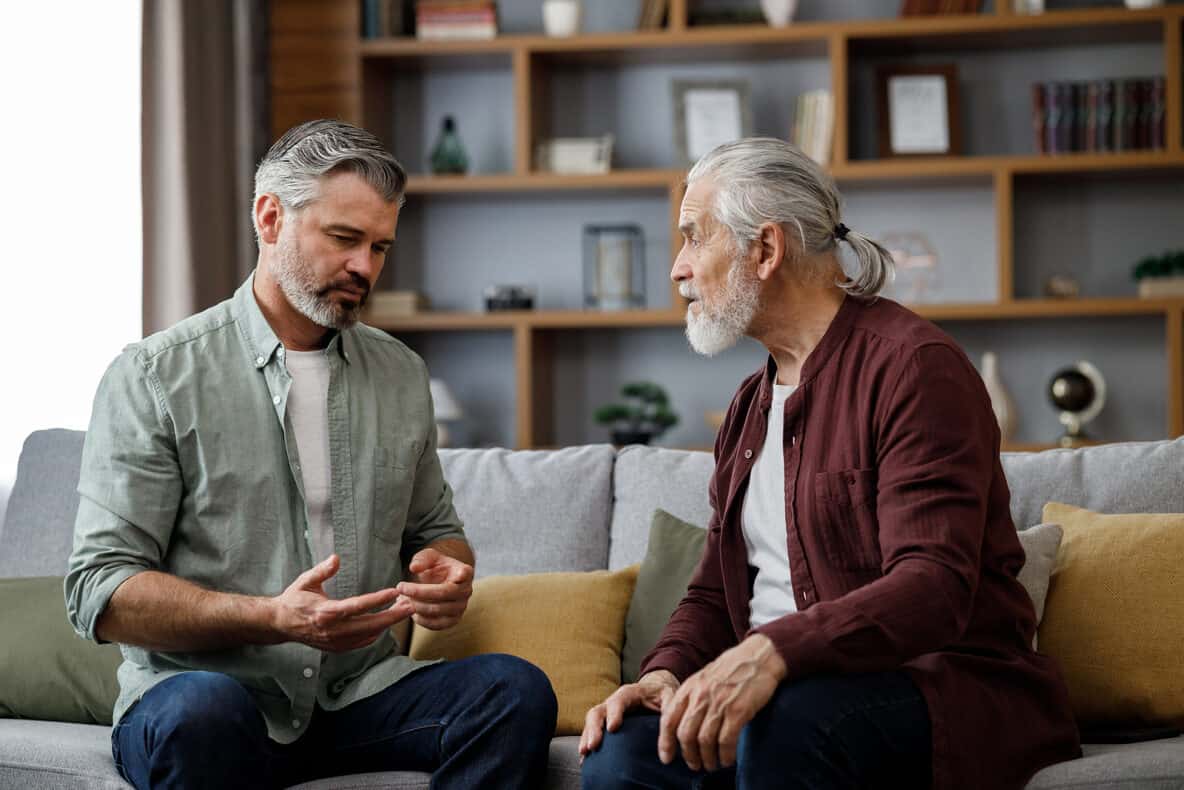 Adult men having a conversation